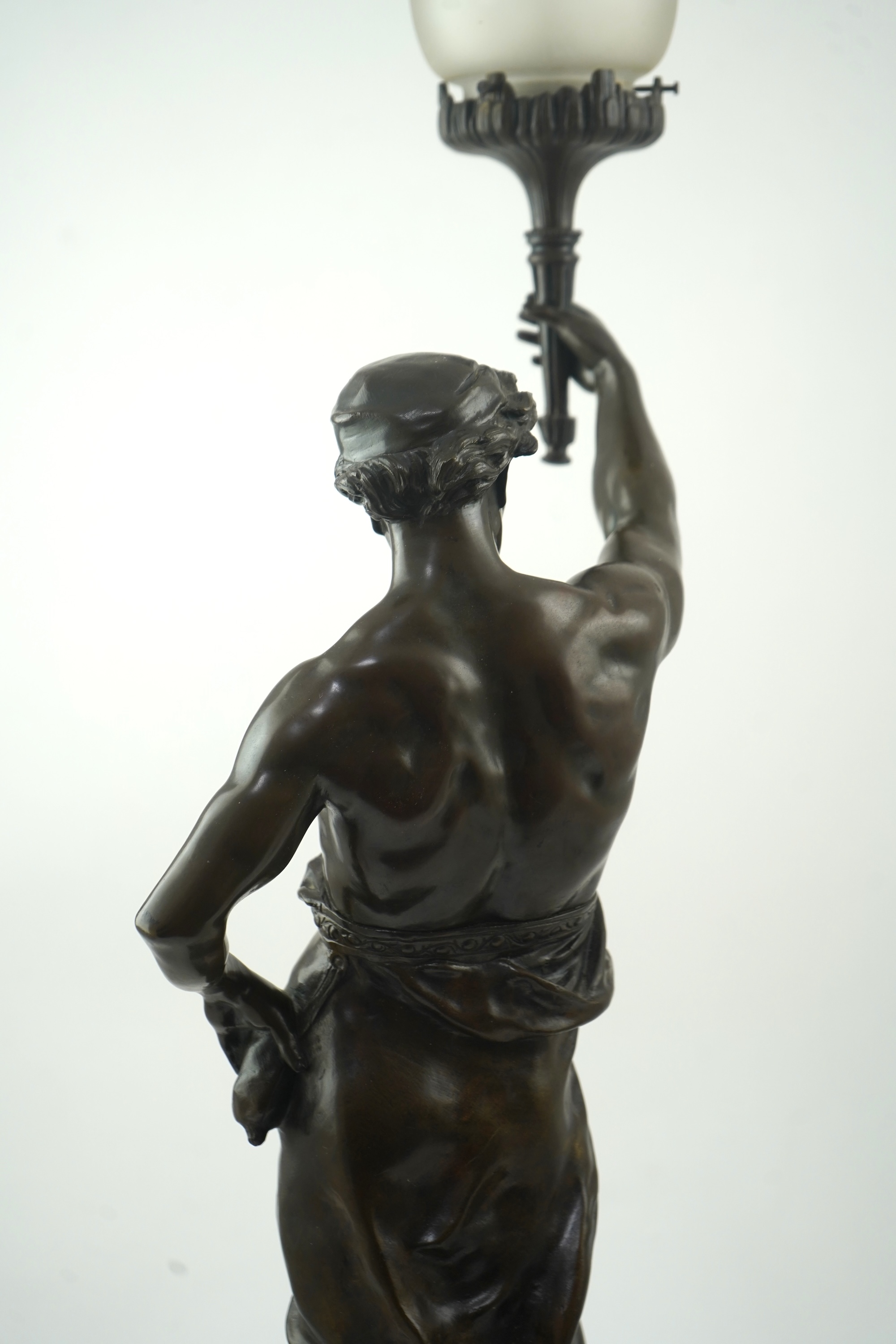 After Émile Louis Picault, a large bronze figural lamp